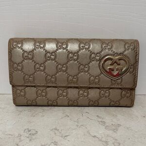 Gucci Gold Embossed Leather Wallet